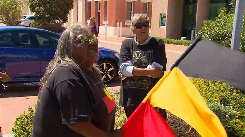 Protesters held flags and chanted.