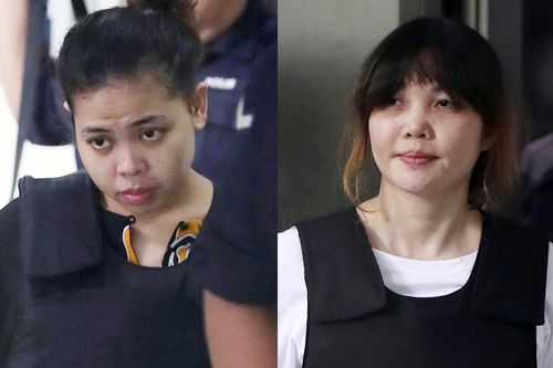 Indonesian Siti Aisyah, left, and Vietnamese Doan Thi Huong, right, escorted by police as they leave a court hearing in Shah Alam, Malaysia, outside Kuala Lumpur