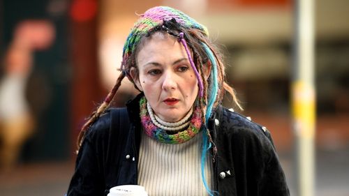 Axe attack victim Sharon Hacker arrives at the Downing Centre District Court in Sydney in July last year.