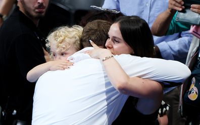 Adam Peaty, his son George and girlfriend Holly Ramsay