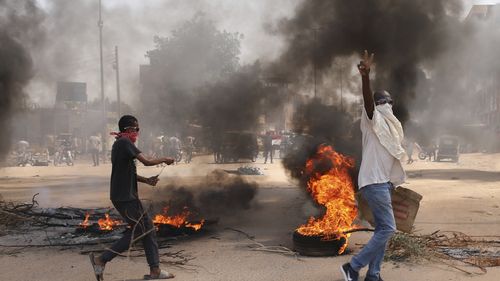 Sudanese demonstrators demand the government's transition to civilian rule in Khartoum, Sudan, Thursday, October 21, 2021.