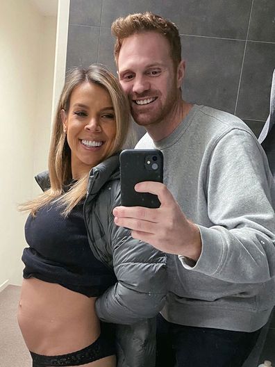 Carly shares a photo of her growing baby bump with boyfriend Neil.