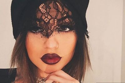 So vampish! <br/><br/>Kylie's blood-red lip and dramatic face lace set the scene for a sexy Insta-snap...