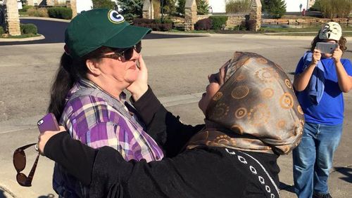 Muslim woman defuses anti-Islam rally outside mosque by giving protester a hug