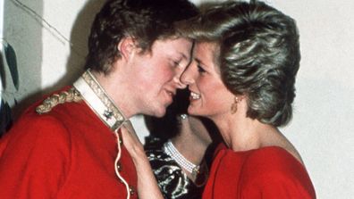 Princess Diana greets her brother Charles at a charity ball.