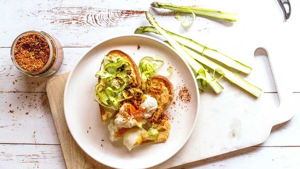 Garlic focaccia with asparagus, chilli hummus and poached eggs