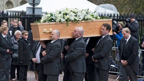 Professor Stephen Hawking's coffin is carried into the church. (EPA)