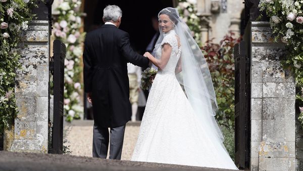 Pippa Middleton in the Giles Deacon wedding dress with her father Michael. Image: Getty