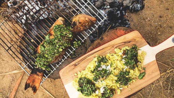 Rice pilaf with flaked whole barbecued barramundi