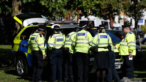 Police fill the park in the middle of Parsons Green. (AAP)