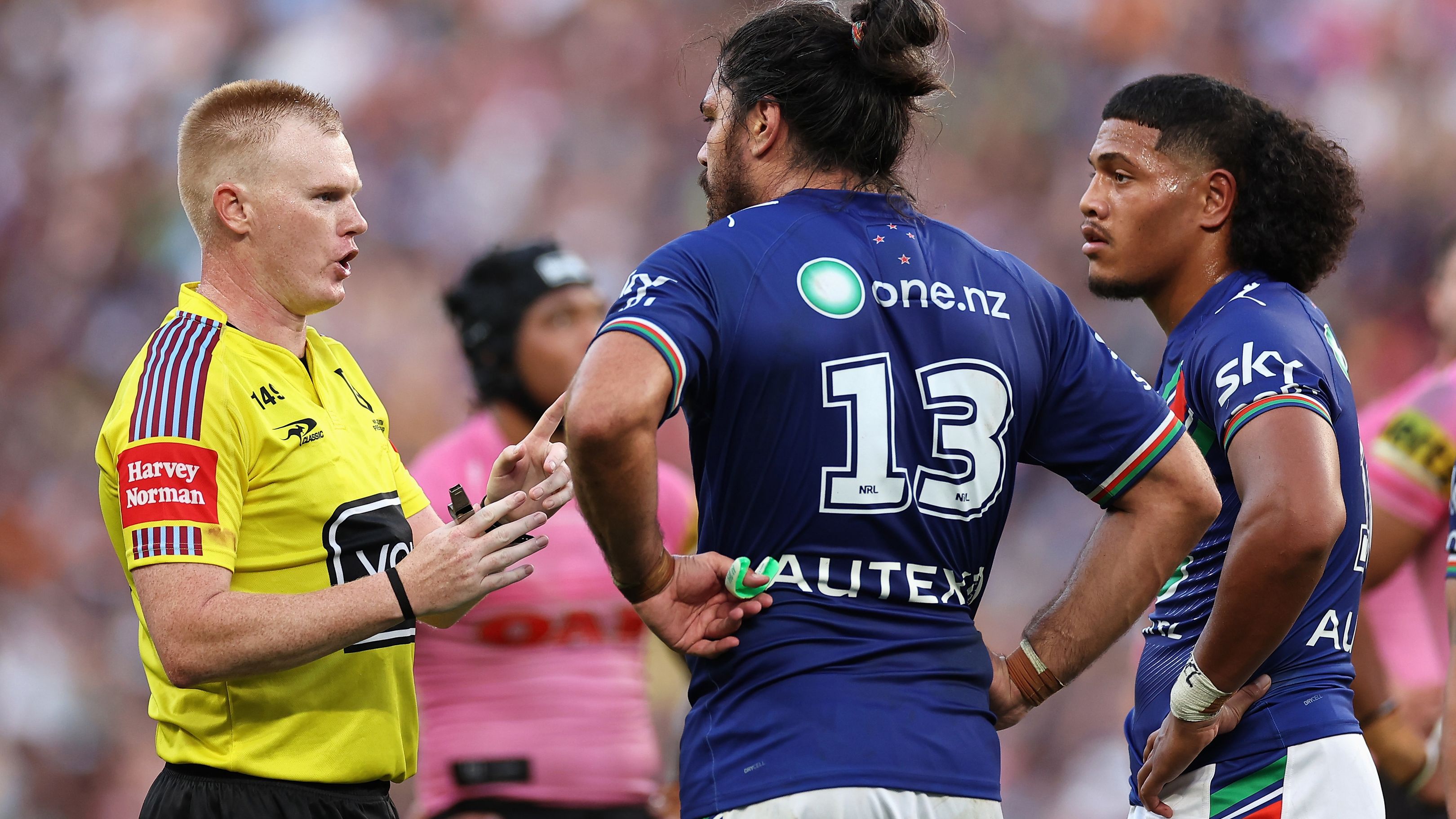 Referee Todd Smith talks to Tohu Harris of the Warriors and Demitric Sifakula.