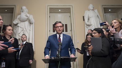 Speaker of the House Mike Johnson, R-La., talks briefly to reporters just before a vote on an interim spending bill to prevent a government shutdown, at the Capitol in Washington, Thursday, Dec. 19, 2024. The vote failed to pass. (AP Photo/J. Scott Applewhite)