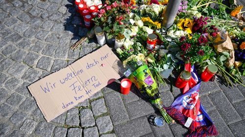 Flowers, candles and tributes near to the site of stabbings that left three dead and eight injured on August 24 in Solingen, Germany.