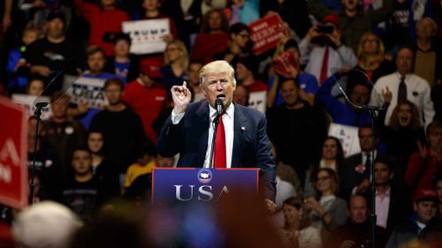 President-elect Donald Trump gestures as he speaks during a "USA Thank You" tour event. (AAP)