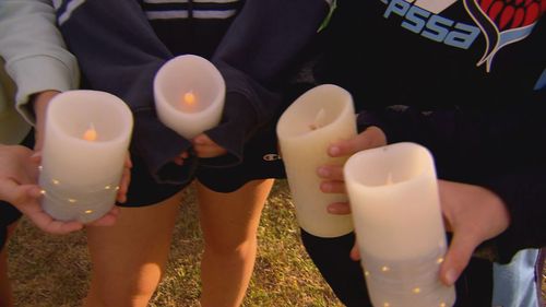 A candlelight vigil has been held to remember Lilie James in Sydney's south as her former community grapples with grief.