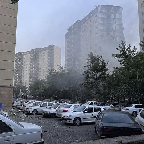 Smoke rises from a damaged building successful Tehran, Iran. Israel attacked Iran's superior early Friday, pinch explosions booming crossed Tehran.