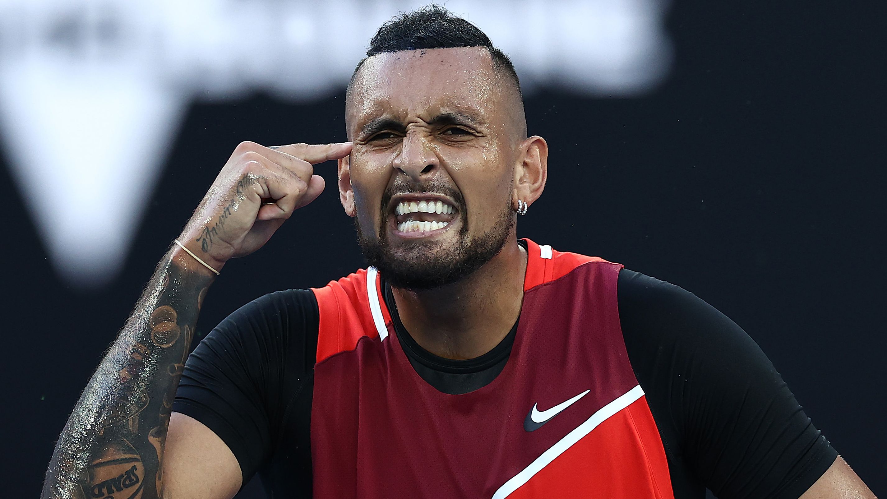 Nick Kyrgios of Australia reacts in his second round singles match against Daniil Medvedev of Russia during day four of the 2022 Australian Open.