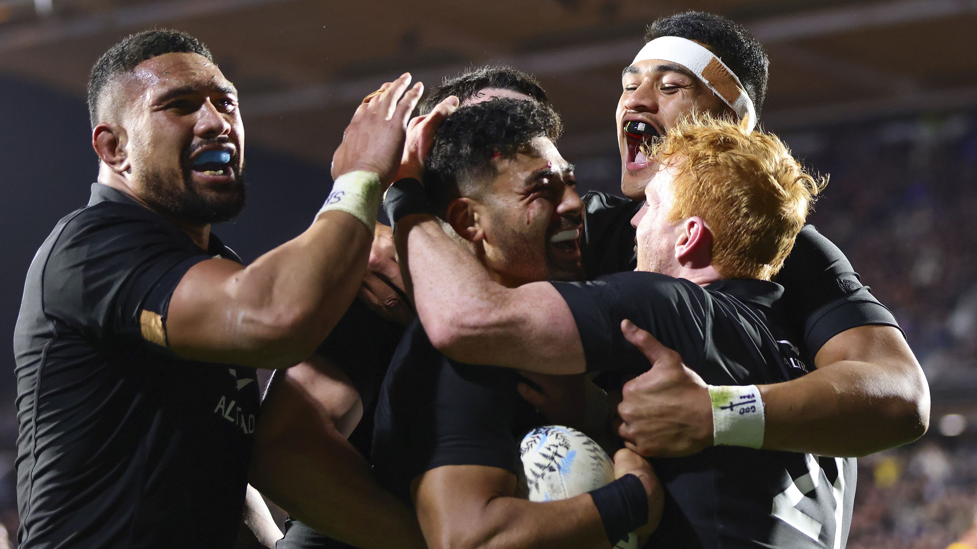 Richie Mo&#x27;unga is congratulated by teammates after scoring a try during the Rugby Championship Test between the All Blacks and Springboks at Mt Smart Stadium.