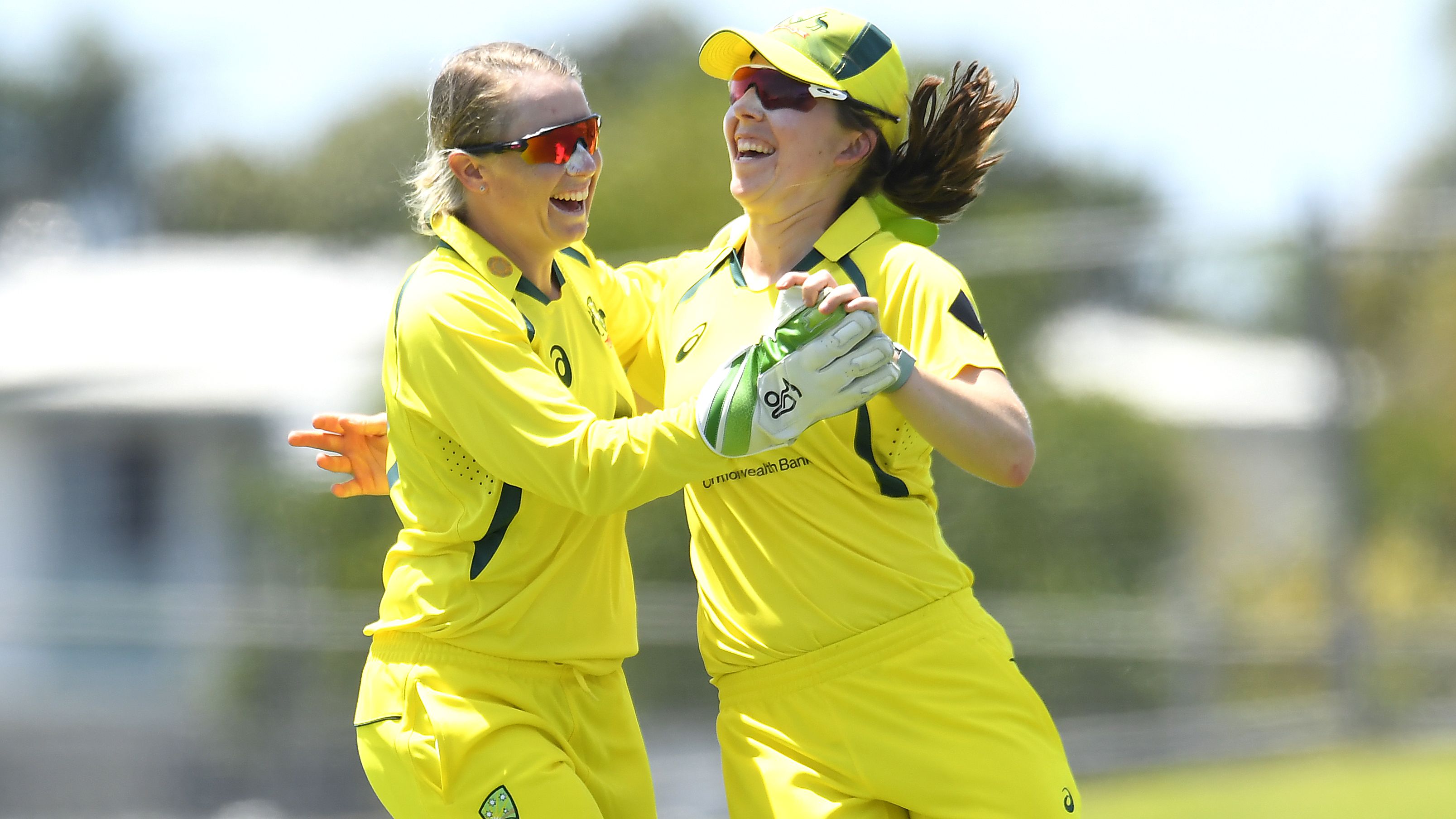 Georgia Wareham of Australia celebrates with Alyssa Healy after catching out Deepti Sharma of India.