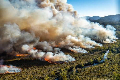 Firefighters are battling extreme conditions as they attempt to control dozens of fierce blazes burning across the state.