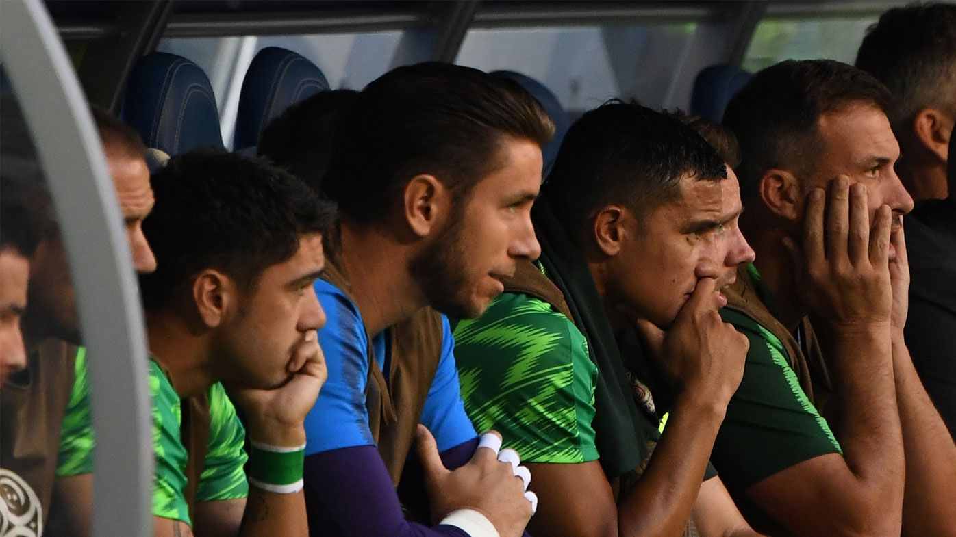 Tim Cahill watches the Socceroos play Denmark from the bench.