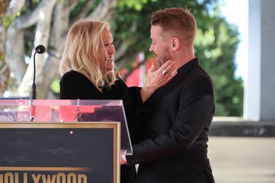 HOLLYWOOD, CALIFORNIA - DECEMBER 01: (L-R) Catherine O'Hara and Macaulay Culkin speak onstage during the ceremony honoring Macaulay Culkin with a Star on the Hollywood Walk of Fame on December 01, 2023 in Hollywood, California. (Photo by Amy Sussman/Getty Images)