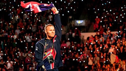 Ormrod celebrates with his family on the podium at the medal ceremony. (Getty)