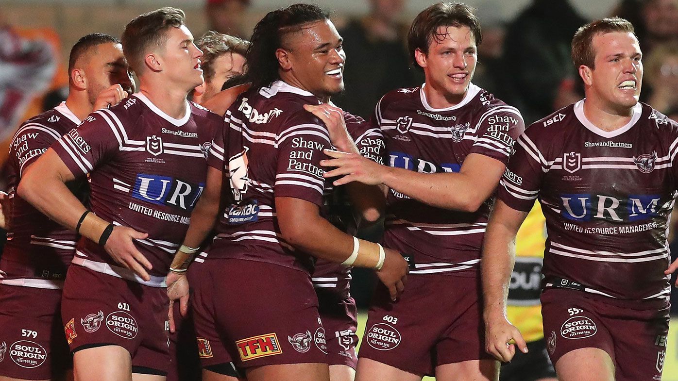 Sea Eagles players celebrate a try scored by Moses Suli 