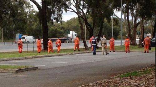 Police and SES personnel search for Daniel Hind at Bolivar today. (9NEWS)