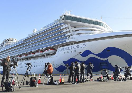 The Princess Diamond which 64 passengers and a crew have been found positive in a new type coronavirus test anchors at Daikoku Wharf in Yokohama