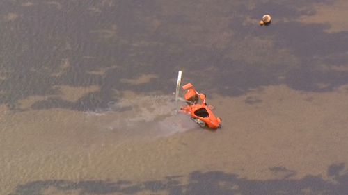 The helicopter crashed into the water. (9NEWS)