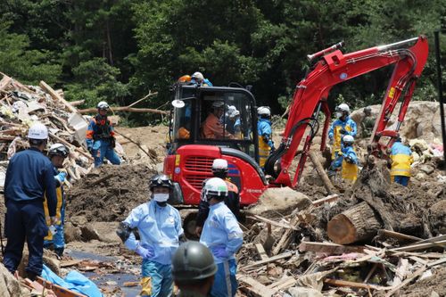 Police rescue workers are searching for missing people in flood-devastated Kumano. Picture: AP