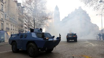 A dozen tanks rolled through the streets of the capital, a show of force the military hoped would keep protestors back. 