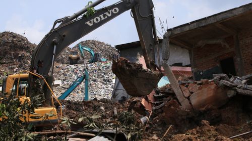 Sri Lankan military rescue workers carry out a rescue operation at the site of a collapsed garbage dump in Colombo. (AFP)