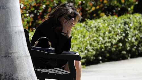 A mourner is overcome with grief at Meadow Pollack's funeral. (AAP)