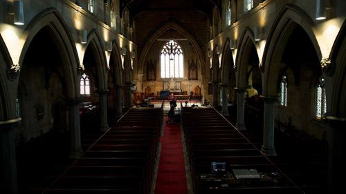 Minister Mike Hastie records a church service to be streamed at Newtown Anglican Church in Sydney.