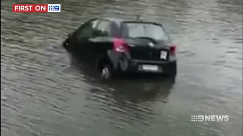 The car began to sink after entering the river. (9NEWS)