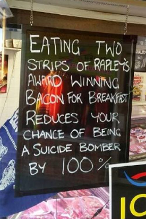 NSW butcher says he didn't mean to offend with 'bacon bomber' sign