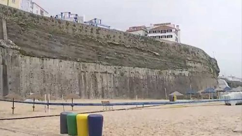 The large stone wall sits 30m above the popular surf beach. Picture: Correio Da Manha