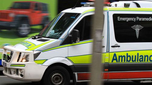 A man has rushed to hospital after he was reportedly bitten by a shark at a Queensland beach.