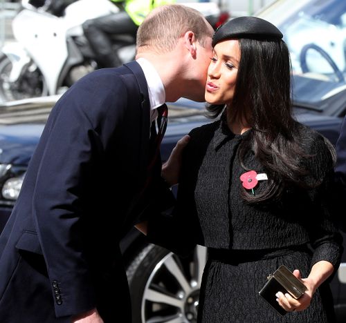 Prince William is greeted by Meghan Markle outside Westminster Abbey. (PA/AAP)