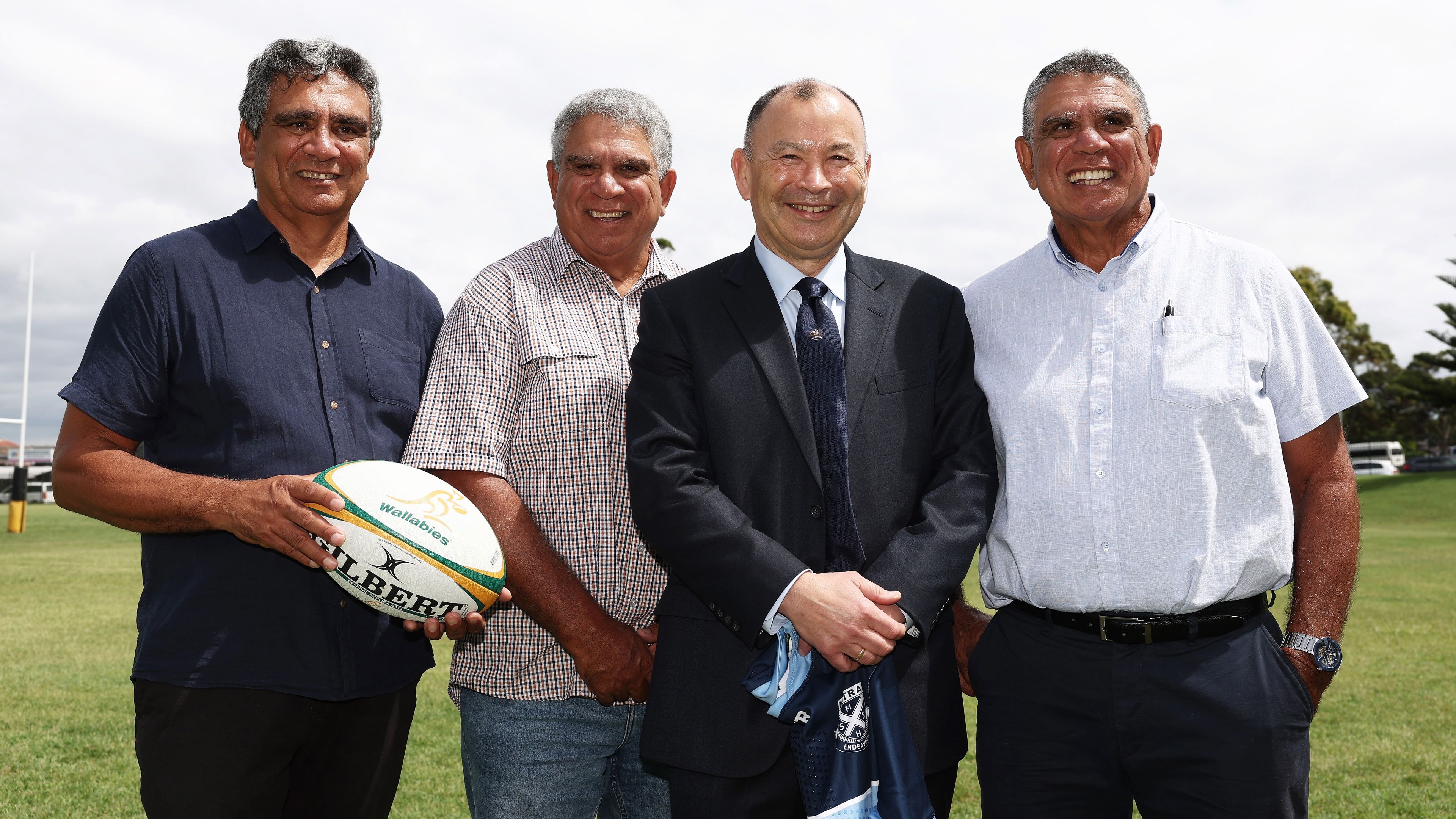 Newly appointed Wallabies coach Eddie Jones (second from right) poses with former Wallabies Gary Ella, Glen Ella and Mark Ella at Matraville Sports High School