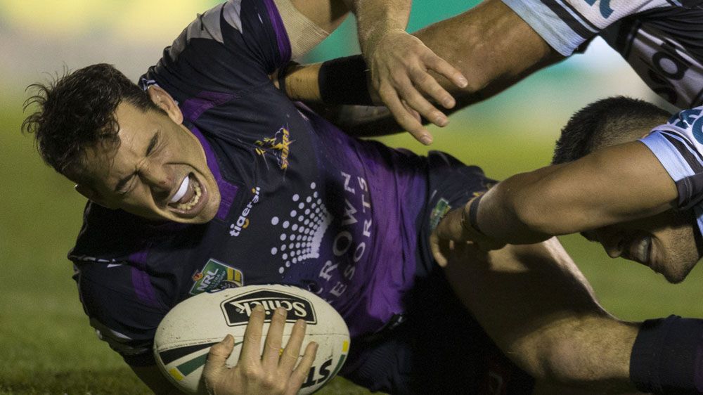 Billy Slater suffers injury scare in close win over Cronulla Sharks