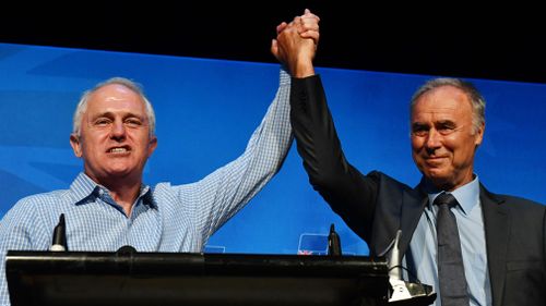 Prime Minister Malcolm Turnbull and newly elected Liberal member for Bennelong John Alexander celebrate at the by-election night party at the West Ryde Leagues Club. (AAP)