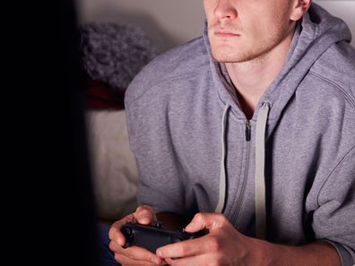 Adult man playing video games