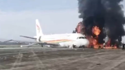 Flames and thick black smoke poured from the Tibet Airlines plane on the tarmac.