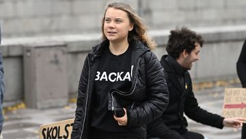 Climate activist Greta Thunberg arrives at the weekly Fridays for Future demonstration at the Mynttorget square next to the Swedish Parliament Riksdagen, in Stockholm, Sweden, on Nov. 11, 2022. 