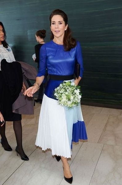 Princess Mary changes her shoes while out with Sweden's Crown Princess Victoria