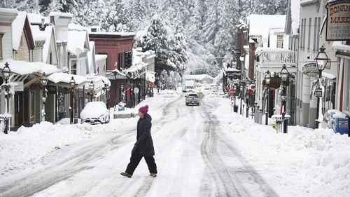 While snowfall was picturesque in places such as along Broad Street in Nevada City, it was dangerous for many others who were without electricity or stuck in the snow. 