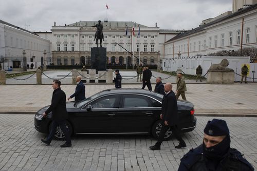 A car carrying Ukraine's President and First Lady of Ukraine arrives for welcoming ceremony at the Presidential Palace in Warsaw, Poland, Wednesday, April 5, 2023.